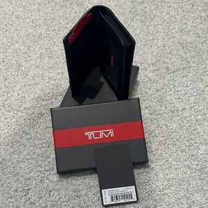 TUMI Black Wallet with Red Detail